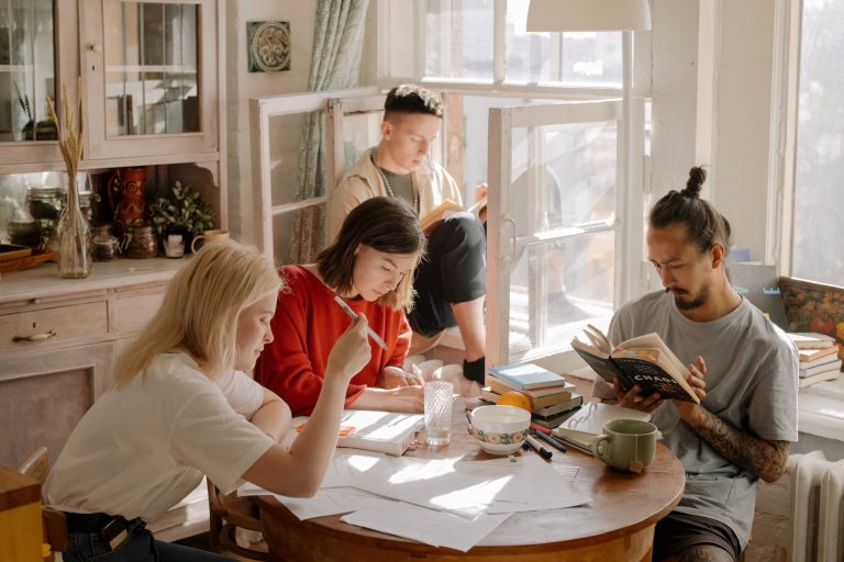 Group of people sitting in kitchen