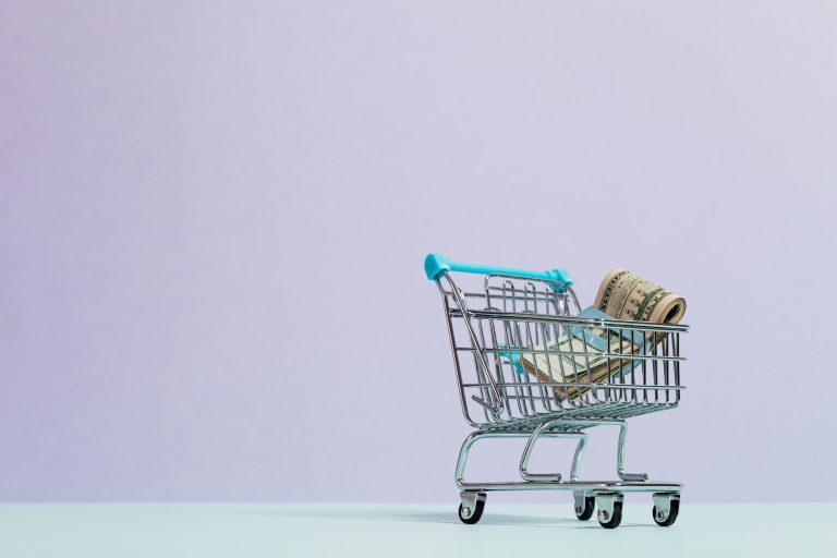 shopping trolley and money